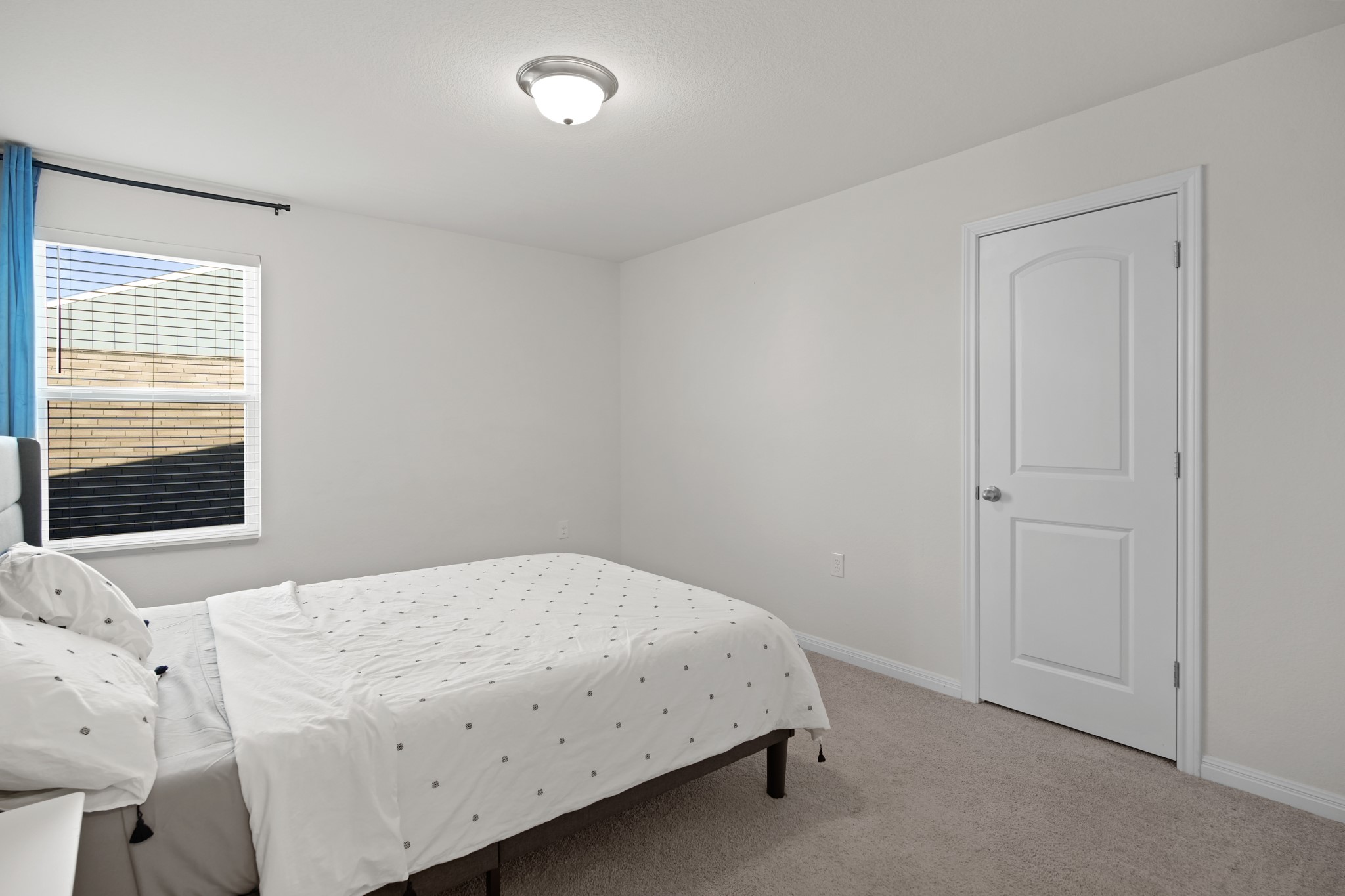 13005 Foreston Drive Austin, TX 78754 - Photo 25 of 36 a bedroom with a bed and a window
