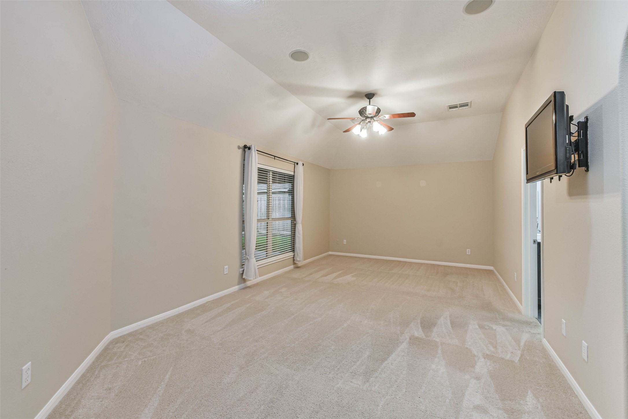 20942 Wind Field Lane Spring, TX 77379 - Photo 24 of 46 an empty room with fan and a ceiling fan