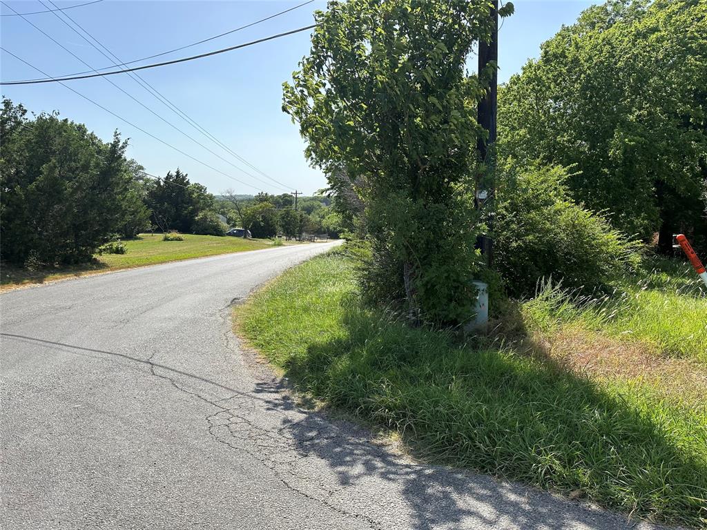 Lot 5 Cedar Road Sherman, TX 75090 - Photo 2 of 20 a view of a yard with plants and a large tree