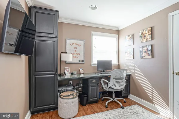a kitchen with a refrigerator and a sink