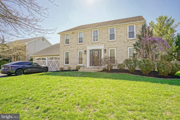 a front view of house with yard and seating area