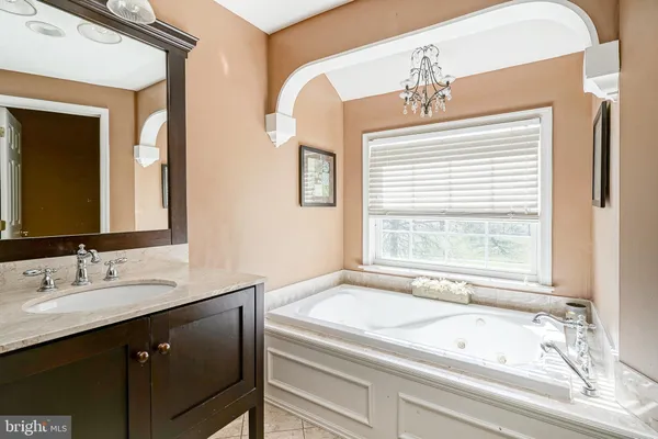 a large white bed in a white room