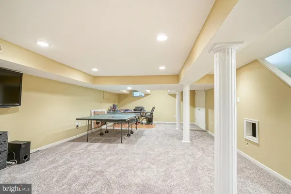 a lobby with furniture and a wooden floor
