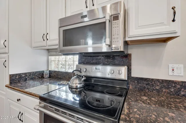 a view of a livingroom with furniture and a fireplace