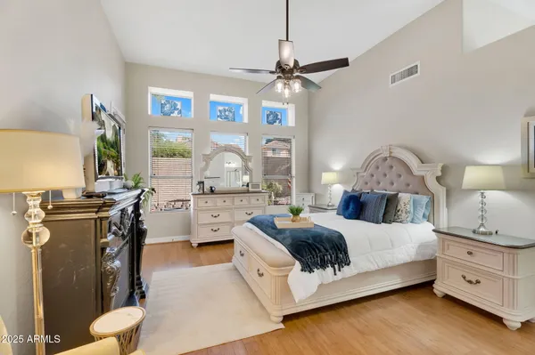 a bathroom with a sink vanity tub and shower