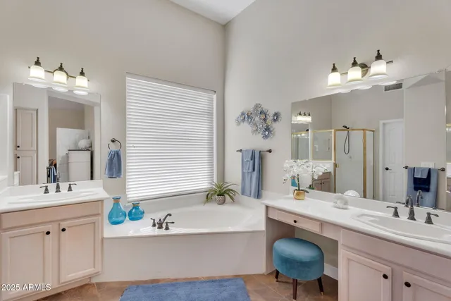 a bath tub sitting in a bathroom next to a window