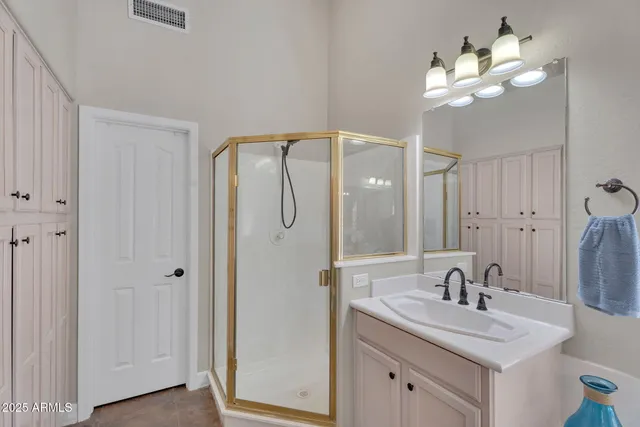 a living room with furniture a flat screen tv and a window