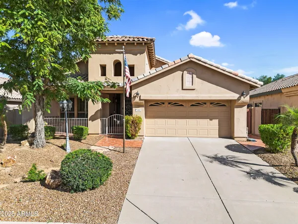 an aerial view of a house with a yard