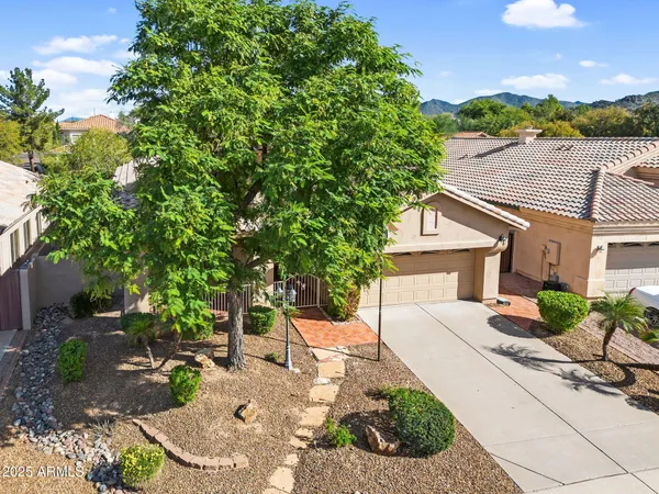 a view of a brick wall with a street