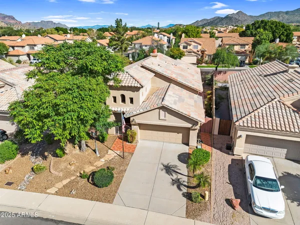 an aerial view of a house with a garden