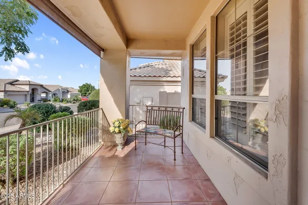 a living room with furniture a fireplace and a large window