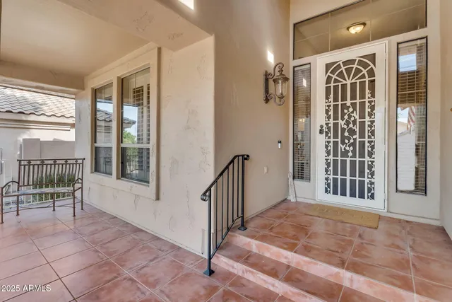 a living room with furniture chandelier and a chandelier