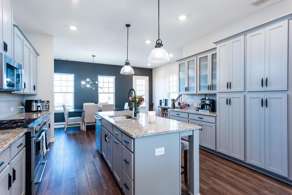2575 Morehead Street Norcross, GA 30071 - Photo 14 of 36 a kitchen with kitchen island granite countertop a sink a counter space appliances and cabinets