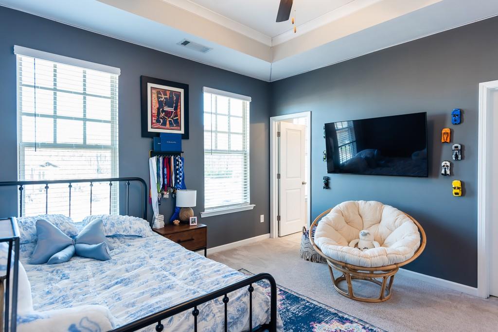 2575 Morehead Street Norcross, GA 30071 - Photo 25 of 36 a living room with furniture and a flat screen tv
