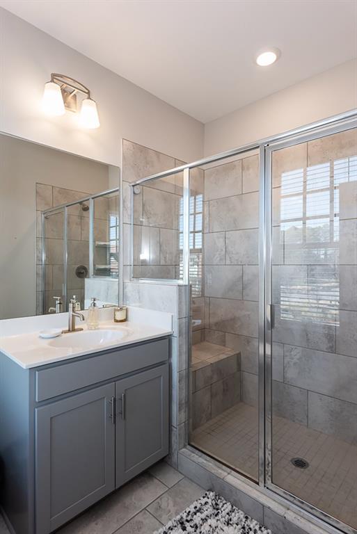 2575 Morehead Street Norcross, GA 30071 - Photo 26 of 36 a bathroom with a shower sink and mirror