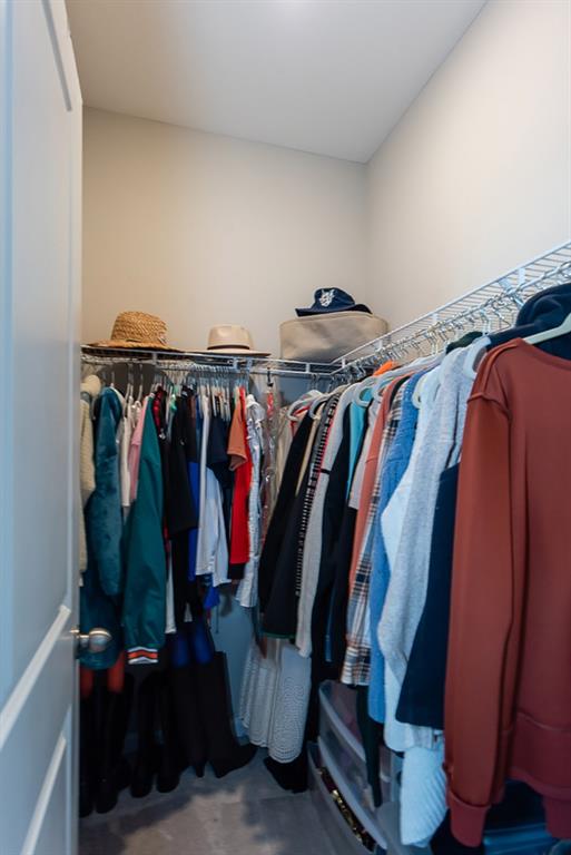 2575 Morehead Street Norcross, GA 30071 - Photo 28 of 36 a view of walk in closet with clothes and shoes