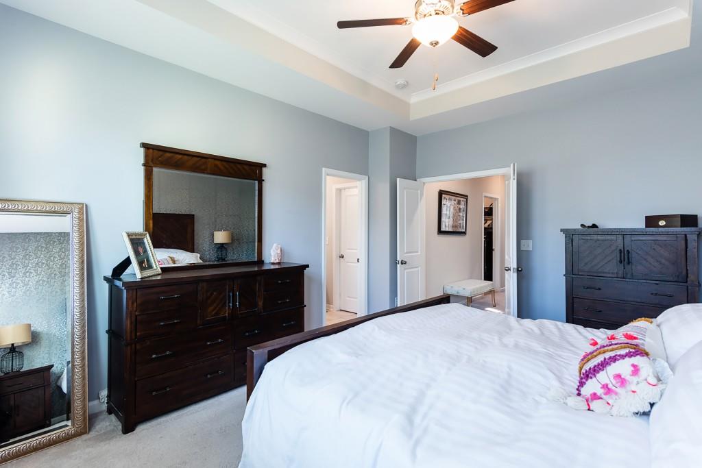 2575 Morehead Street Norcross, GA 30071 - Photo 29 of 36 a bedroom with a bed and a mirror on dresser