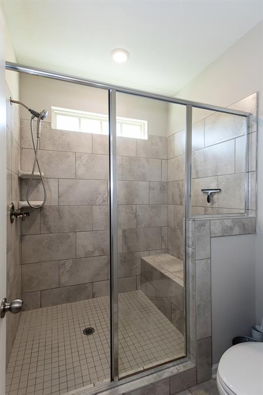 2575 Morehead Street Norcross, GA 30071 - Photo 31 of 36 a bathroom with a shower a toilet and sink