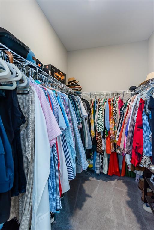 2575 Morehead Street Norcross, GA 30071 - Photo 32 of 36 a view of walk in closet with clothes and shoes