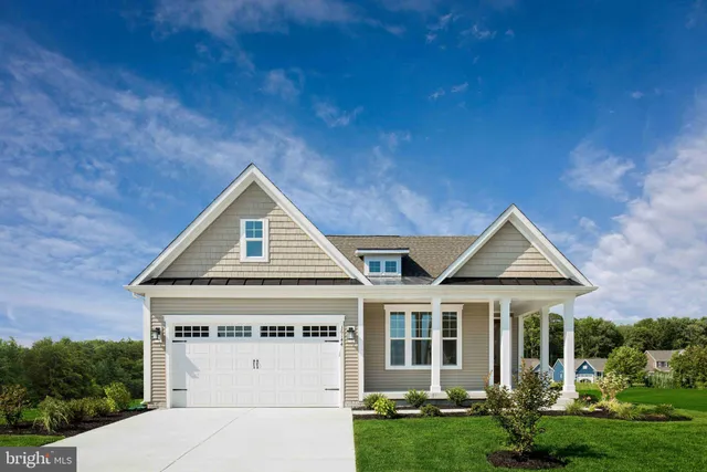 a view of white house with a yard