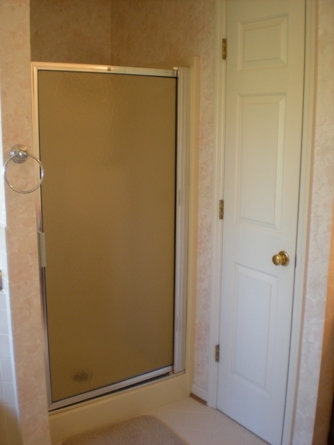 422 Stonehaven Lane Blue Ridge, VA 24064 - Photo 14 of 44 a bathroom with a glass shower door