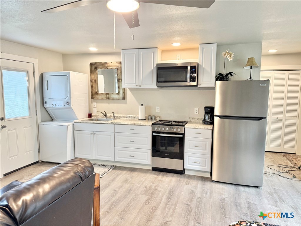 2518 Marlandwood Road Temple, TX 76502 - Photo 47 of 48 a kitchen with stainless steel appliances a refrigerator sink and stove top oven