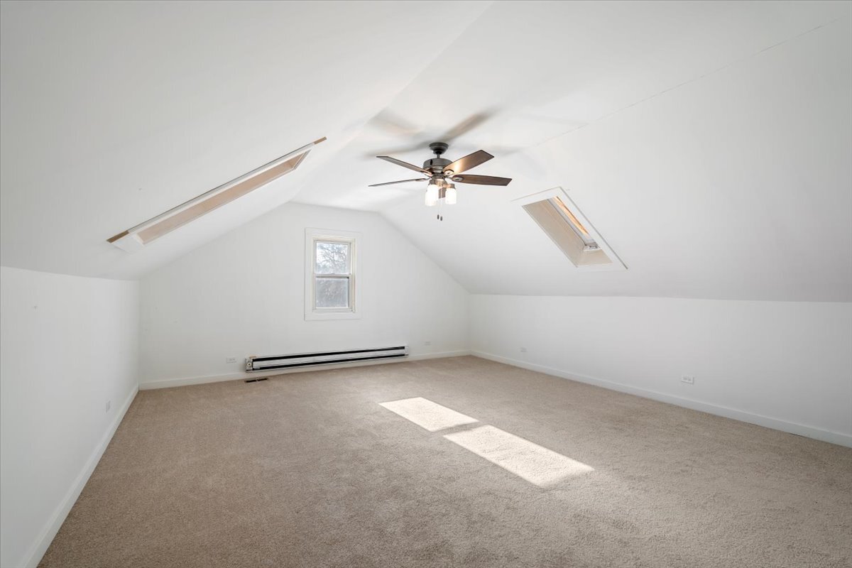 318 East Liberty Street Wauconda, IL 60084 - Photo 14 of 30 an empty room with ceiling fan and windows