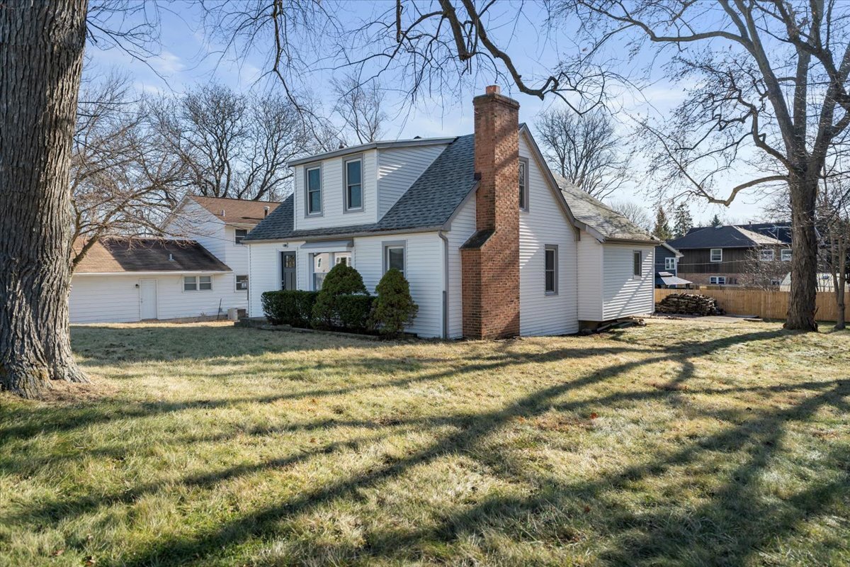 318 East Liberty Street Wauconda, IL 60084 - Photo 19 of 30 a view of a white house with a yard covered in snow