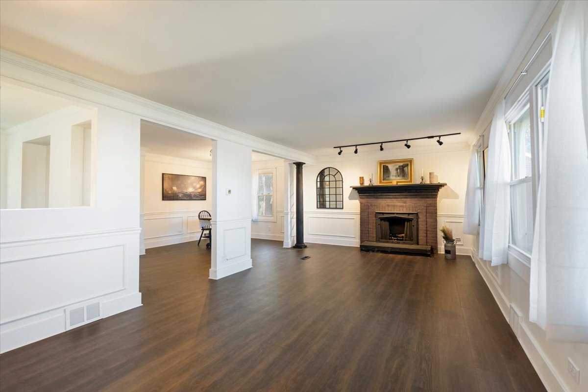 318 East Liberty Street Wauconda, IL 60084 - Photo 5 of 30 an empty room with fireplace wooden floor and windows