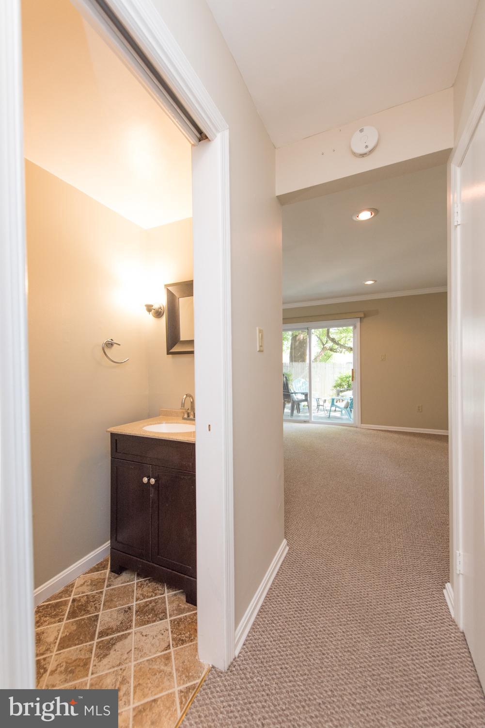 10943 Amherst Avenue Silver Spring, MD 20902 - Photo 17 of 25 Half Bath in Lower Level with Pocket Door