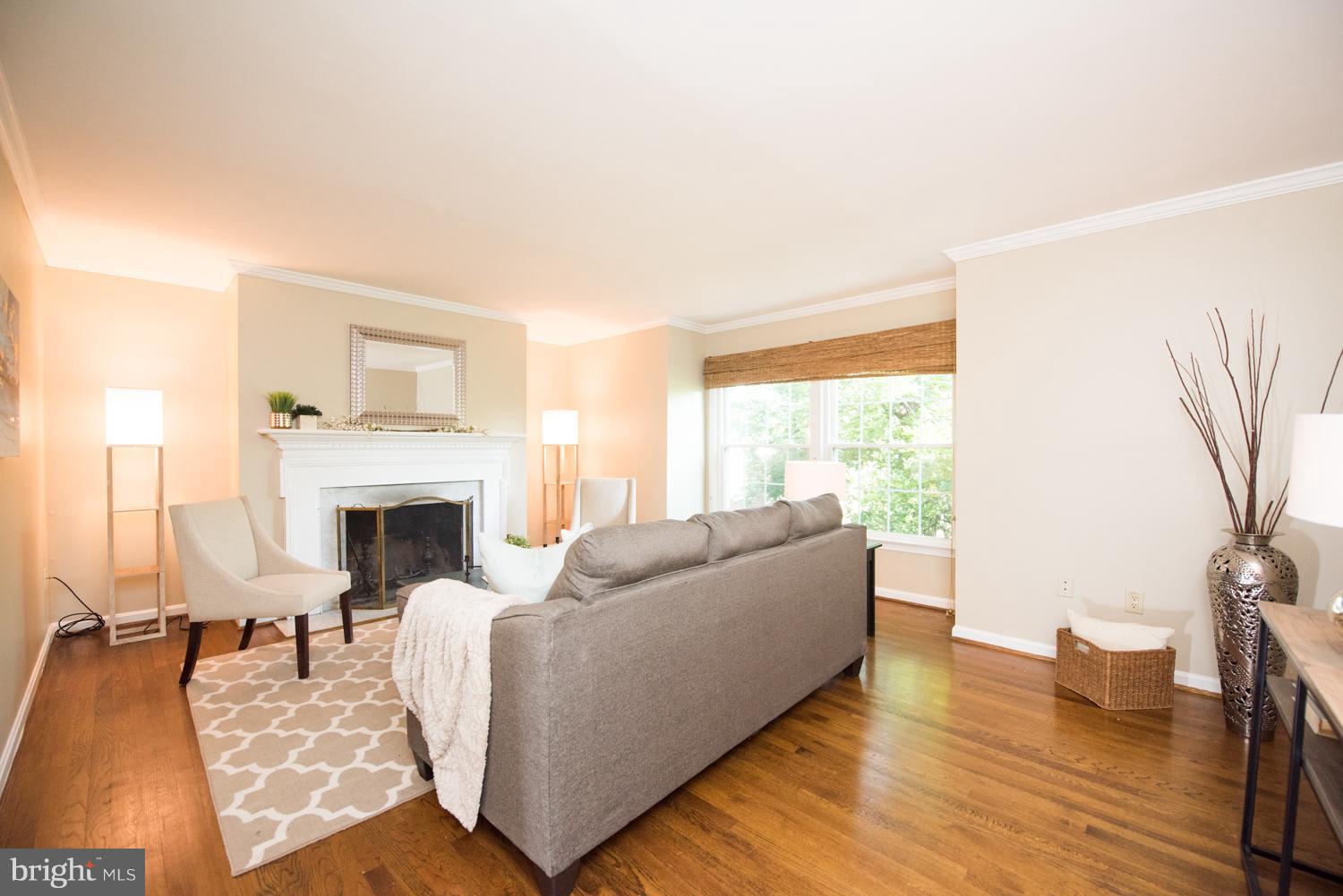 10943 Amherst Avenue Silver Spring, MD 20902 - Photo 6 of 25 Large, light filled living room w/ wood fireplace