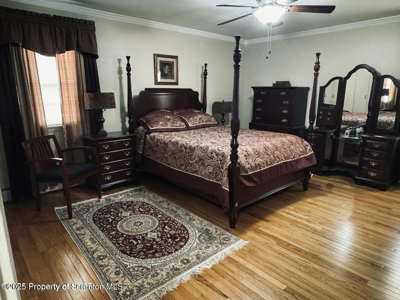171 Limewood Road Shavertown, PA 18708 - Photo 20 of 41 a bedroom with a bed a dresser and flat screen tv