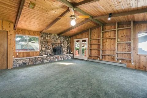 a view of a room with wooden walls