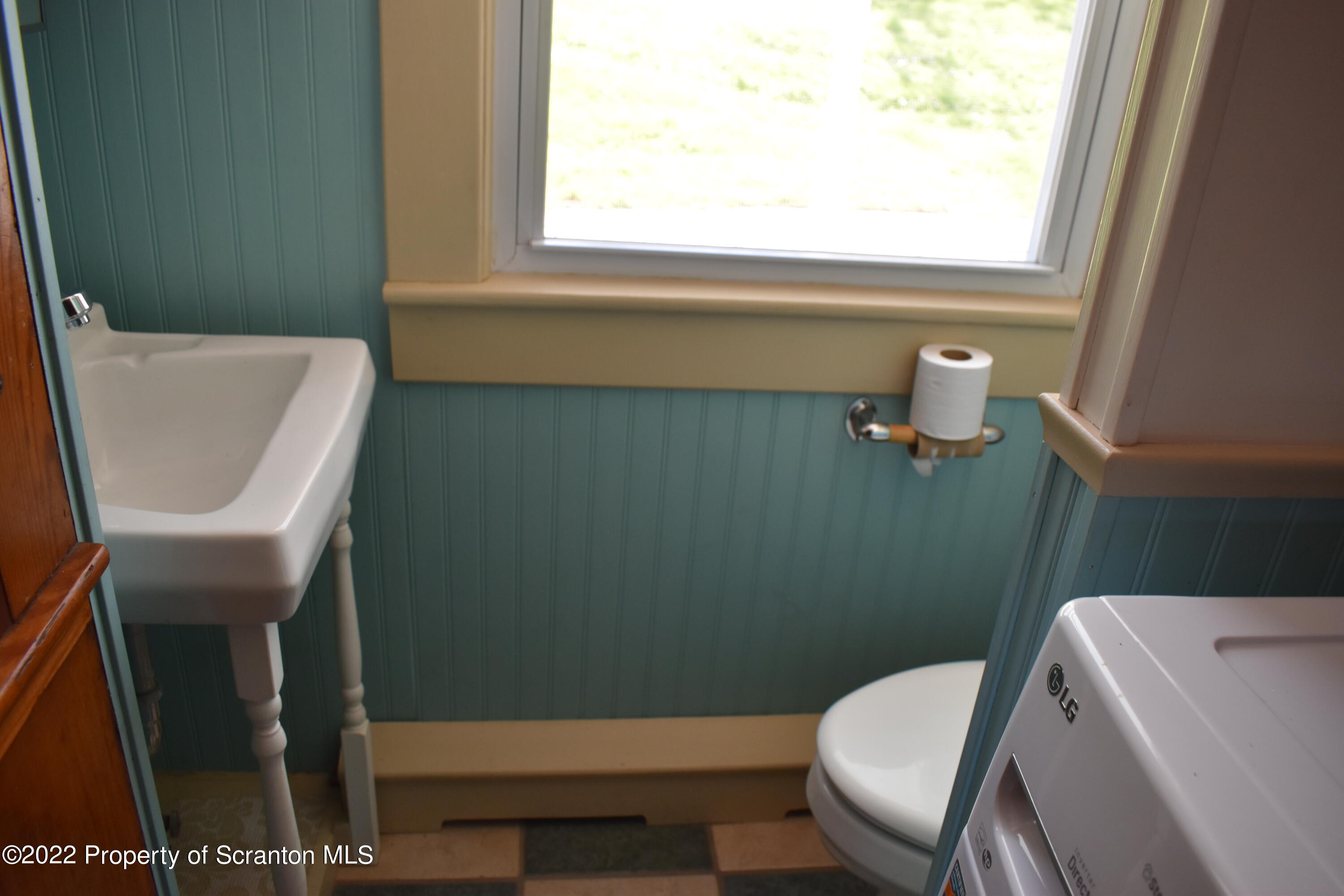 15850 State Rte 3001 Montrose, PA 18801 - Photo 11 of 66 a bathroom with a toilet a sink and a window