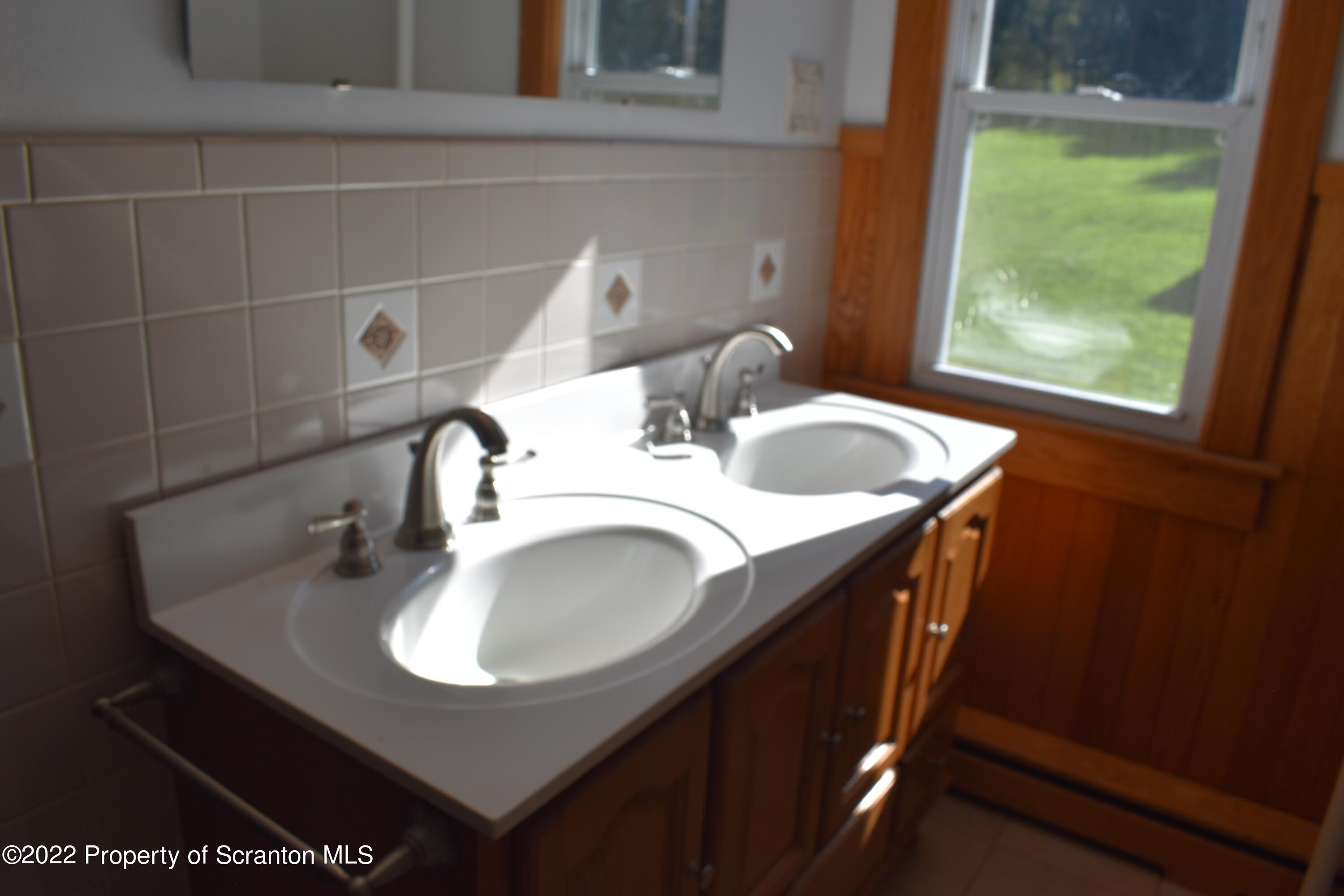 15850 State Rte 3001 Montrose, PA 18801 - Photo 28 of 66 a bathroom with a sink and a mirror
