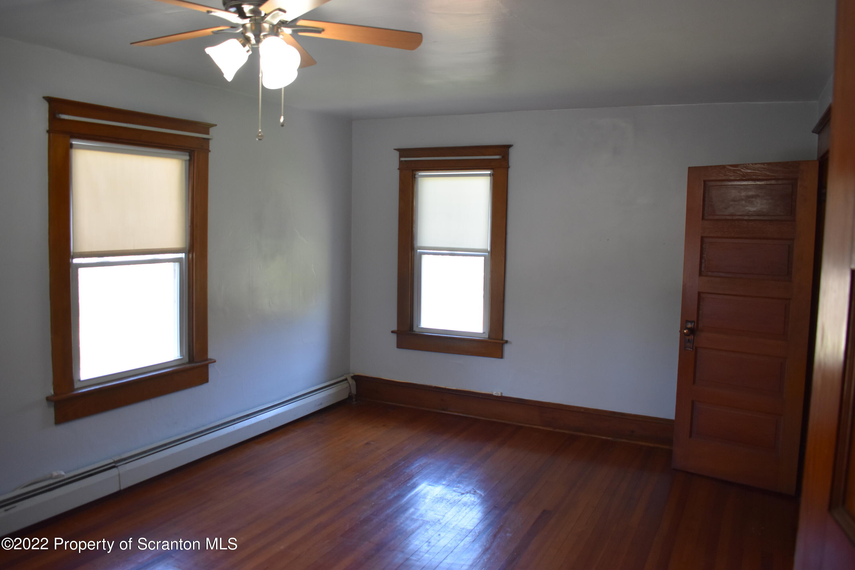 15850 State Rte 3001 Montrose, PA 18801 - Photo 29 of 66 an empty room with wooden floor closet and windows