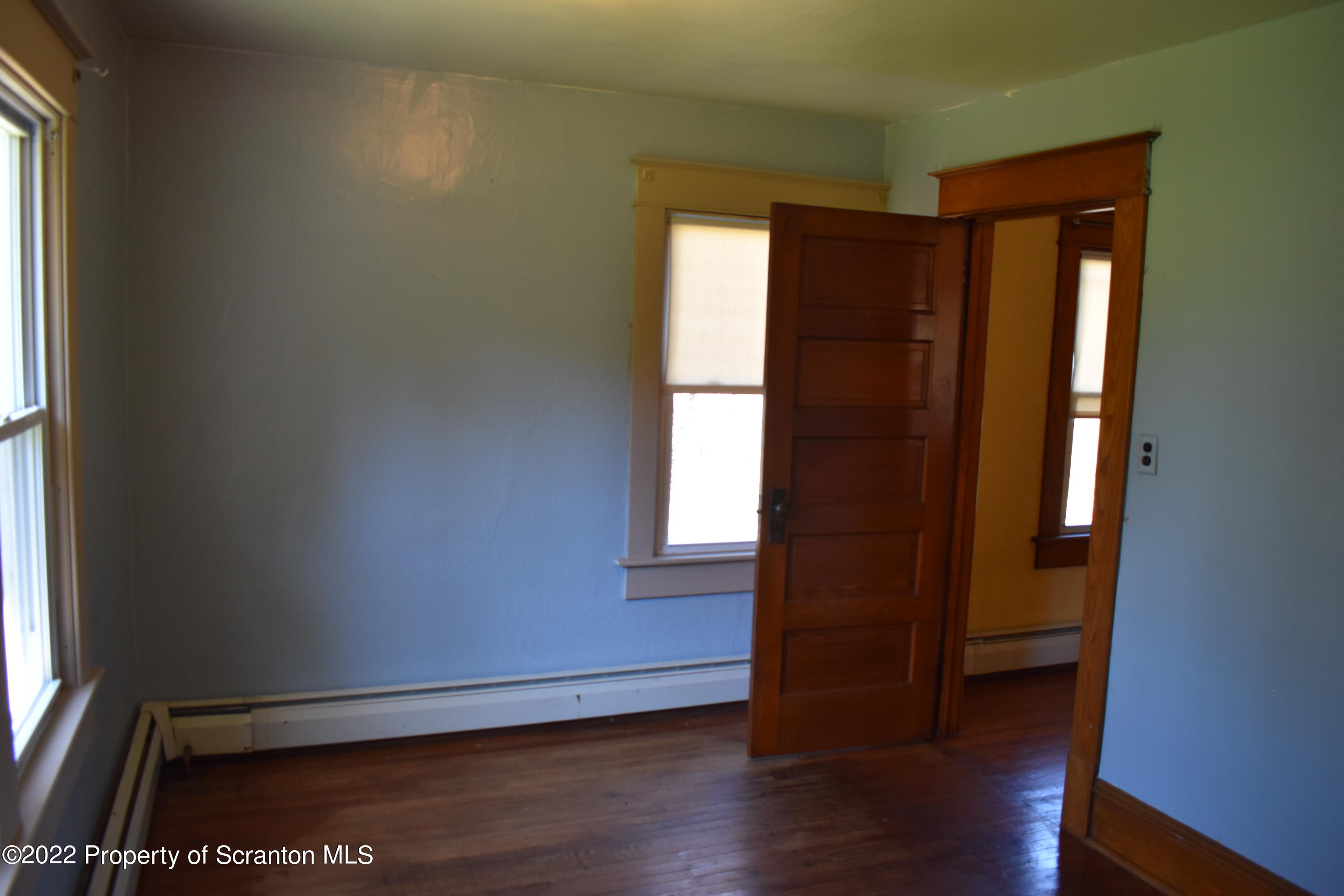 15850 State Rte 3001 Montrose, PA 18801 - Photo 32 of 66 an empty room with wooden floor and windows