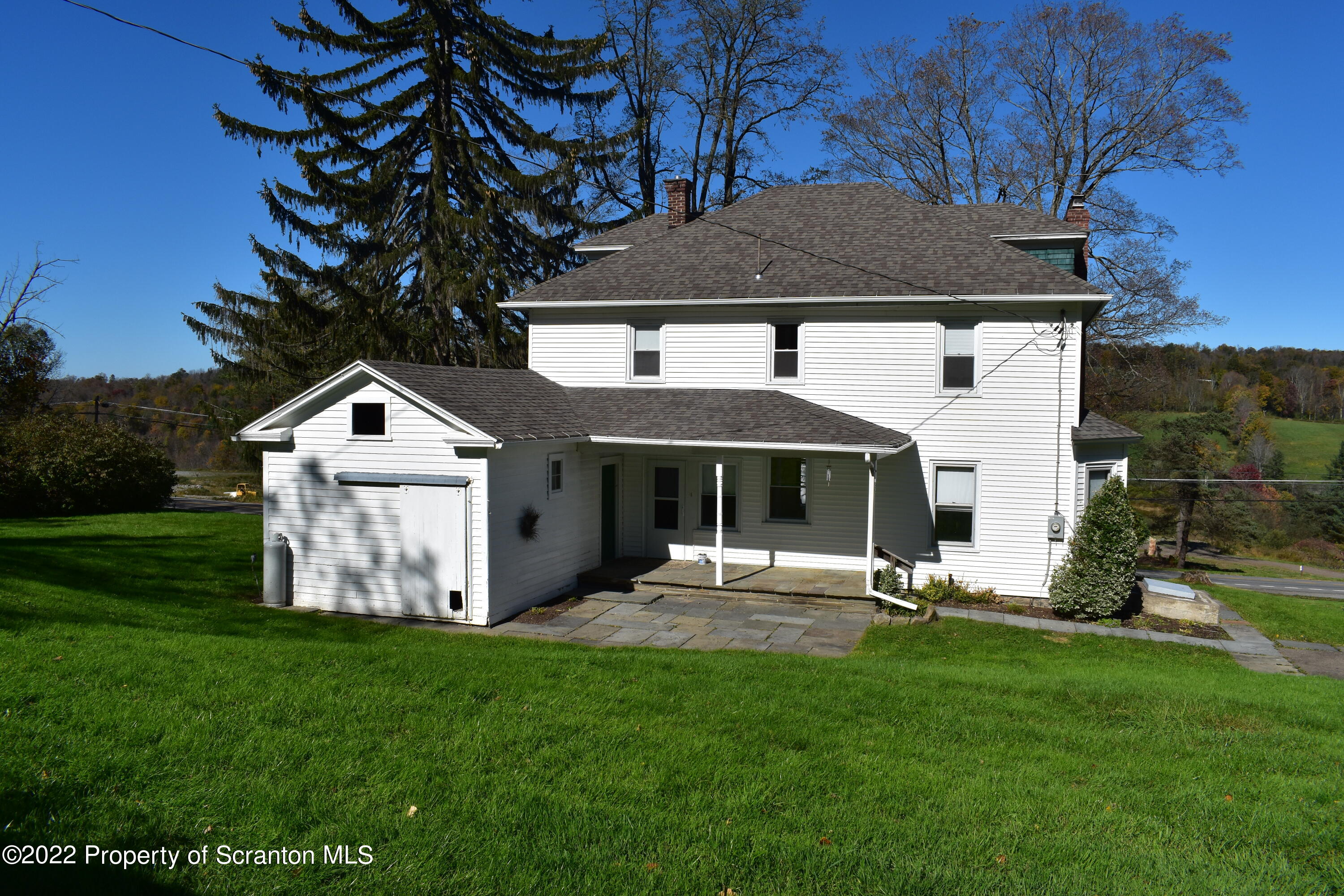 15850 State Rte 3001 Montrose, PA 18801 - Photo 34 of 66 a front view of a house with garden