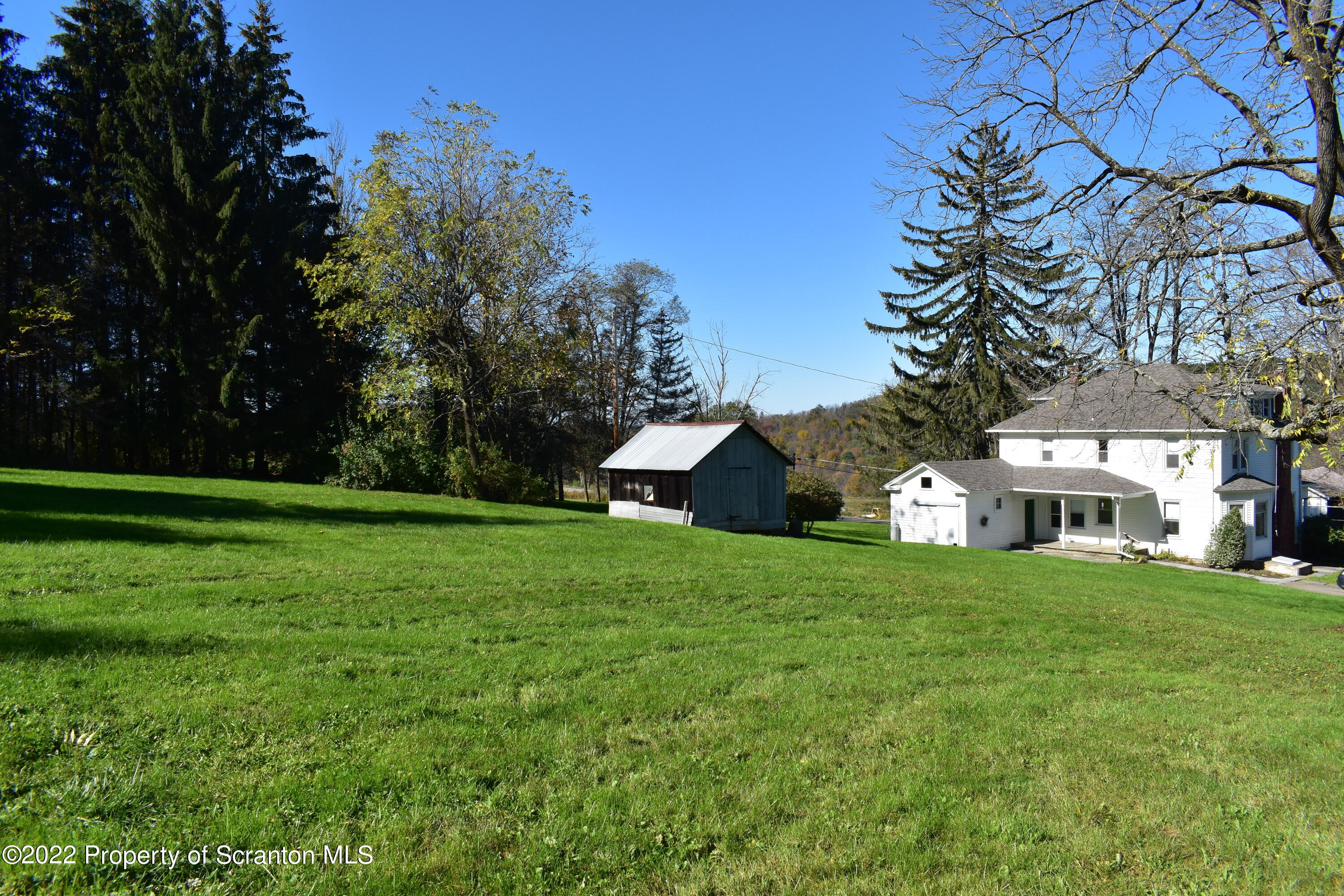 15850 State Rte 3001 Montrose, PA 18801 - Photo 46 of 66 a front view of a house with a yard