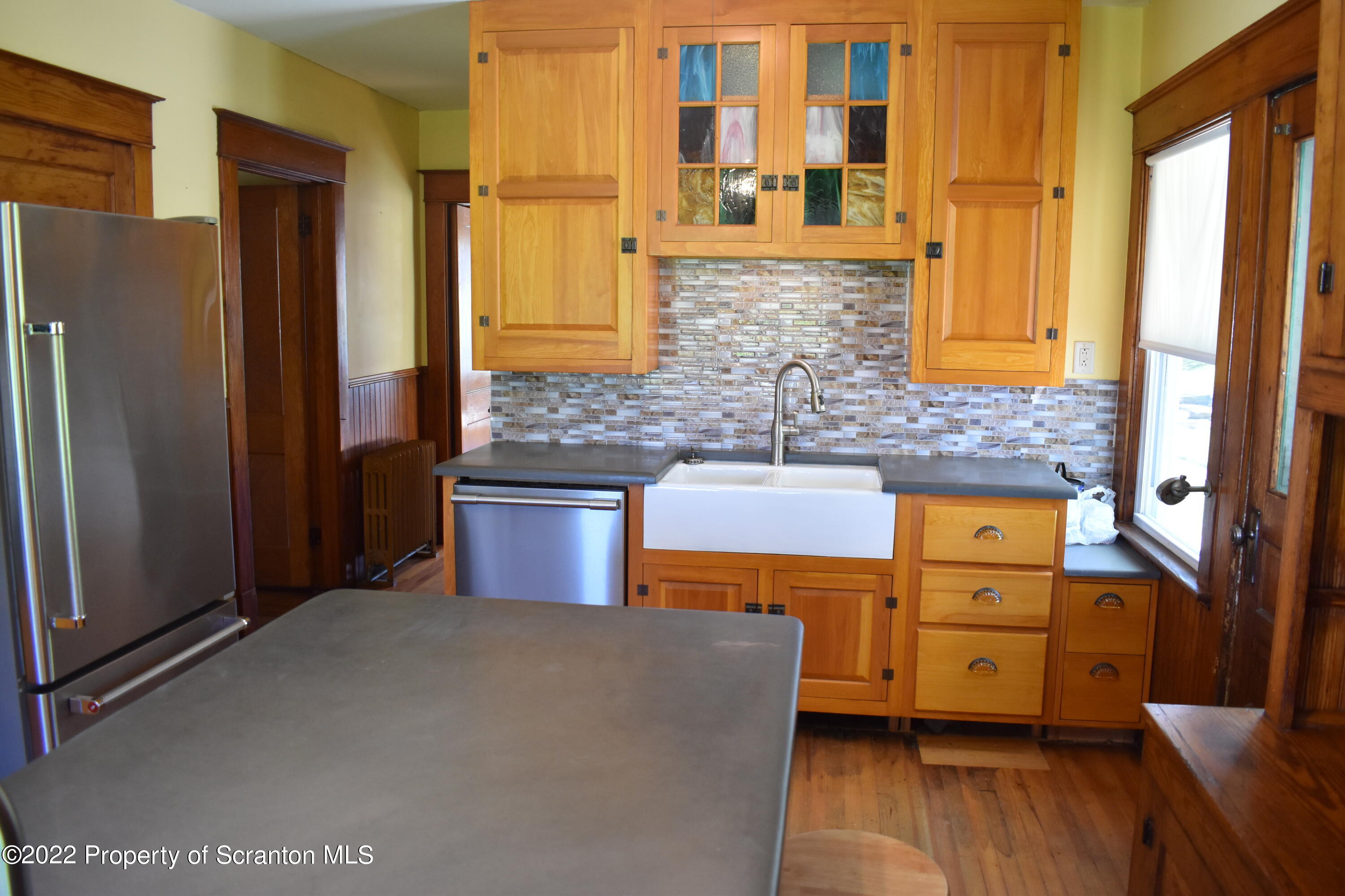 15850 State Rte 3001 Montrose, PA 18801 - Photo 8 of 66 a kitchen with stainless steel appliances granite countertop a refrigerator a sink and wooden cabinets