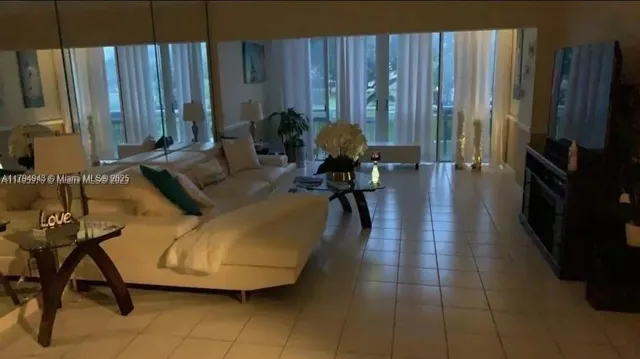 a view of a room with gym equipment next to a window