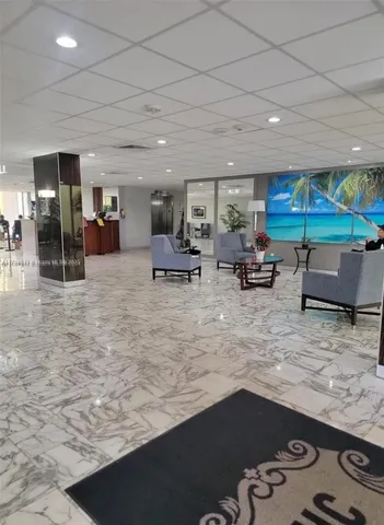 a bedroom with a bed and a lamp