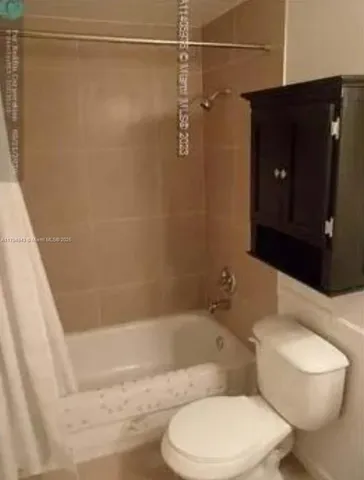 a bed room with a bed and a chair