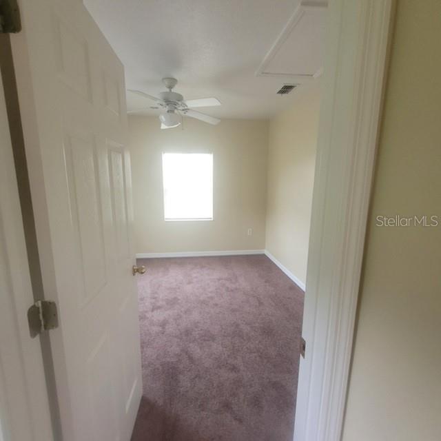 1001 Aultman Road Kissimmee, FL 34744 - Photo 14 of 17 an empty room with windows and closet