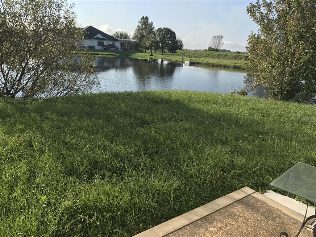 1001 Aultman Road Kissimmee, FL 34744 - Photo 17 of 17 a view of a lake with houses with outdoor space