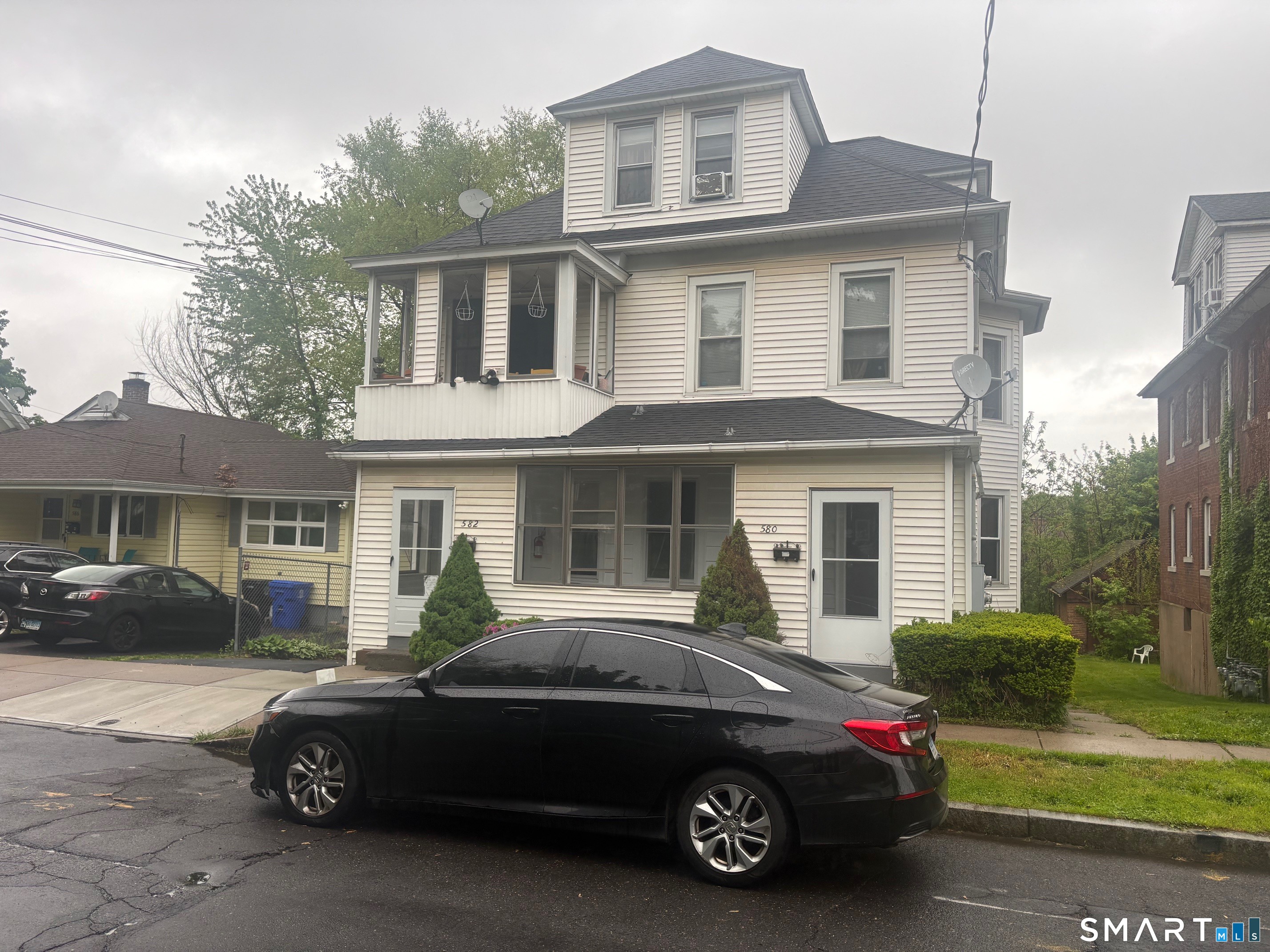 580 High Street Middletown, CT 06457 - Photo 1 of 11 a car parked in front of a house