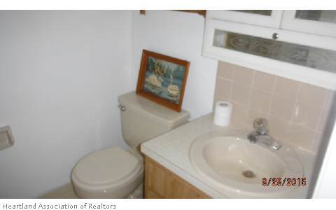 4356 Skipper Road Sebring, FL 33875 - Photo 7 of 16 a bathroom with a toilet sink and mirror
