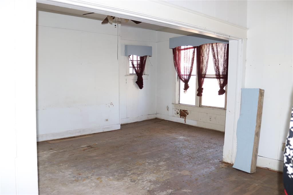 417 North Scullin Avenue Denison, TX 75020 - Photo 10 of 16 a view of an empty room with a window