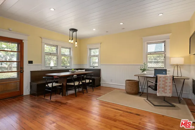 a outdoor living room with furniture and a large window