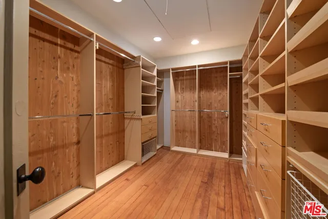 a view of a patio with table and chairs and potted plants